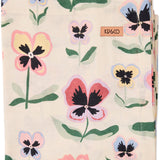 Kip & Co Pretty Pansy Tablecloth with vibrant floral pattern displayed on a dining table.