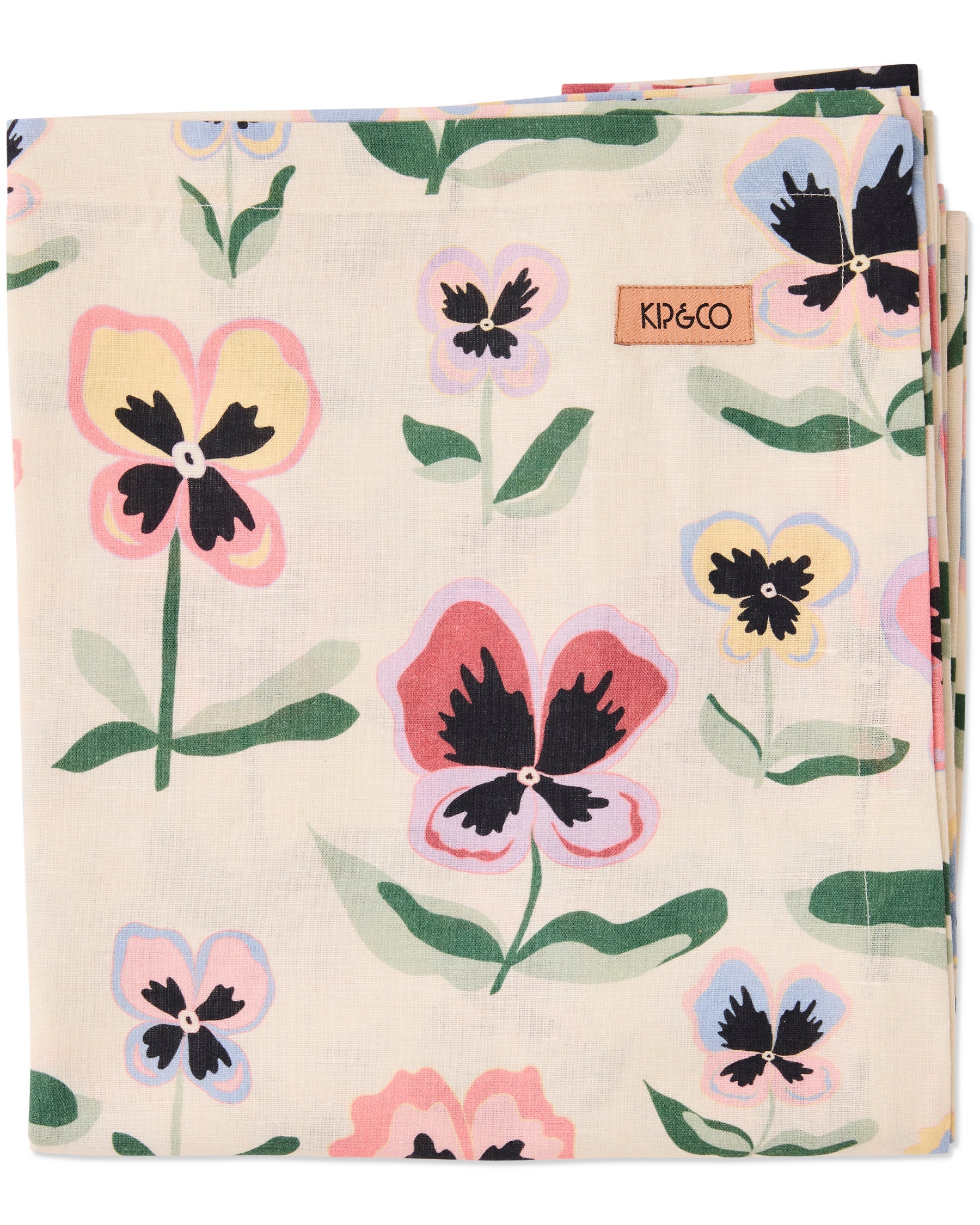 Kip & Co Pretty Pansy Tablecloth with vibrant floral pattern displayed on a dining table.