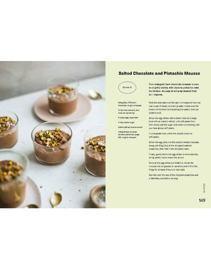 Open baking book featuring pistachio recipes from Brumby Sunstate, showing colorful pages with pistachio desserts and pastries.