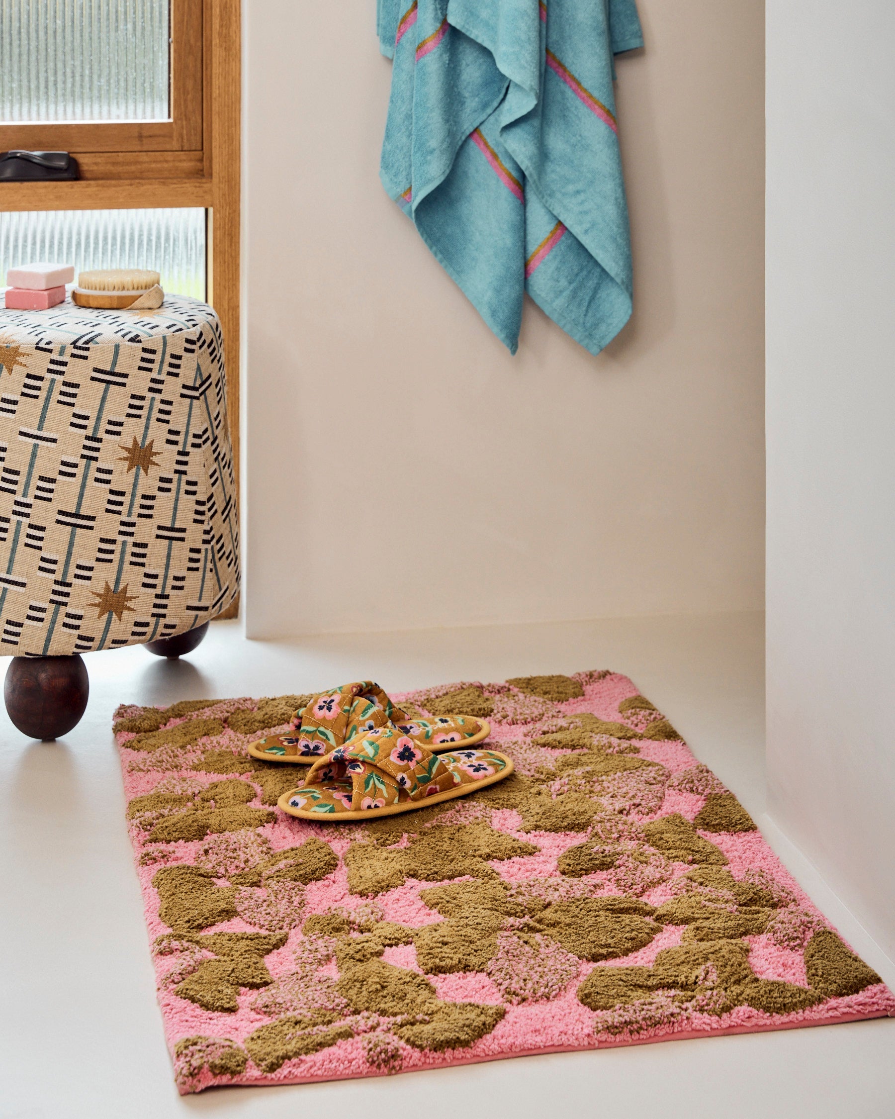 Kip & Co Bloom Bath Mat with colorful floral pattern, non-slip surface, plush texture, designed for bathroom decor and comfort.