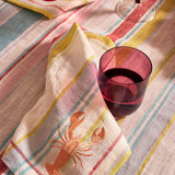 Kip & Co lilac fiesta carafe and matching glass set with colorful pattern, perfect for serving beverages in style.