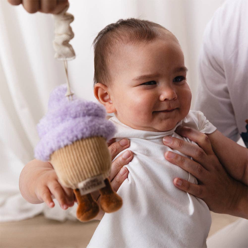 Living Textiles stroller toys featuring colorful ice cream and cupcake plush designs for babies and toddlers.
