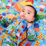 Kip & Co Dinosaur Roar organic long sleeve baby romper with zipper, featuring colorful dinosaur print on soft fabric.
