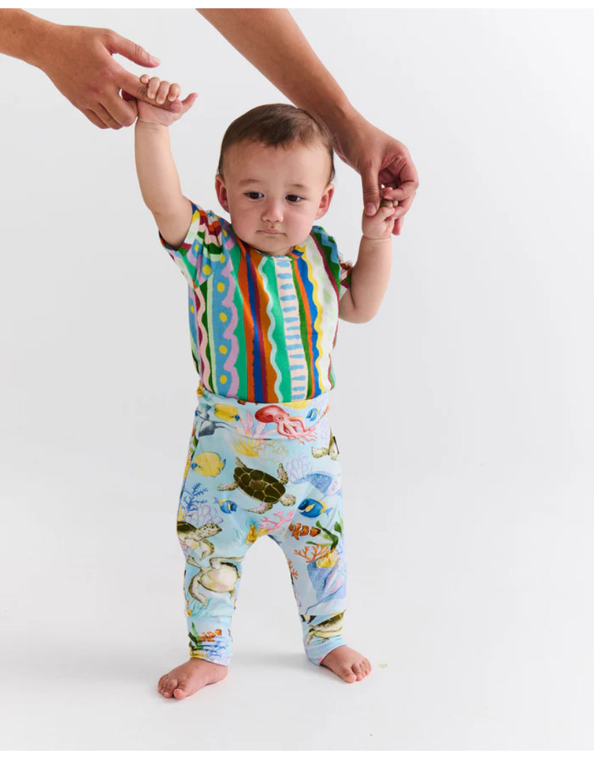 Kip & Co baby beach pattern short sleeve romper with colorful print, soft fabric, and comfortable fit for warm weather.