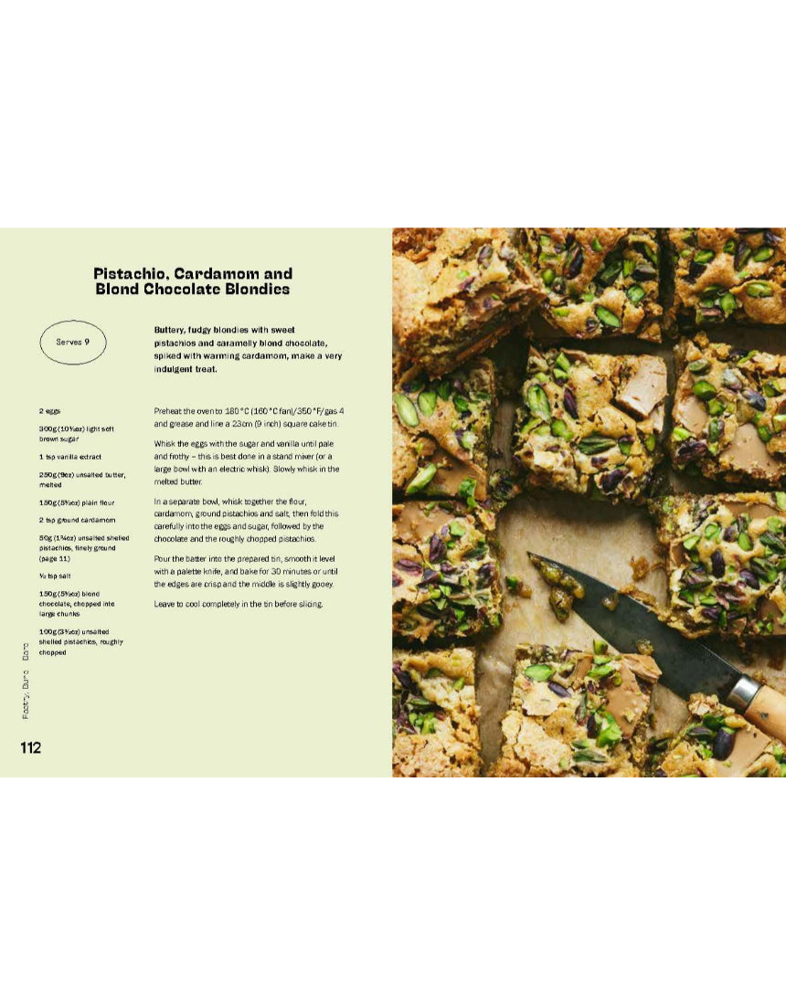 Open baking book titled "The Pistachio Lover's Baking Book" by Brumby Sunstate, showcasing pistachio dessert recipes and colorful pages.