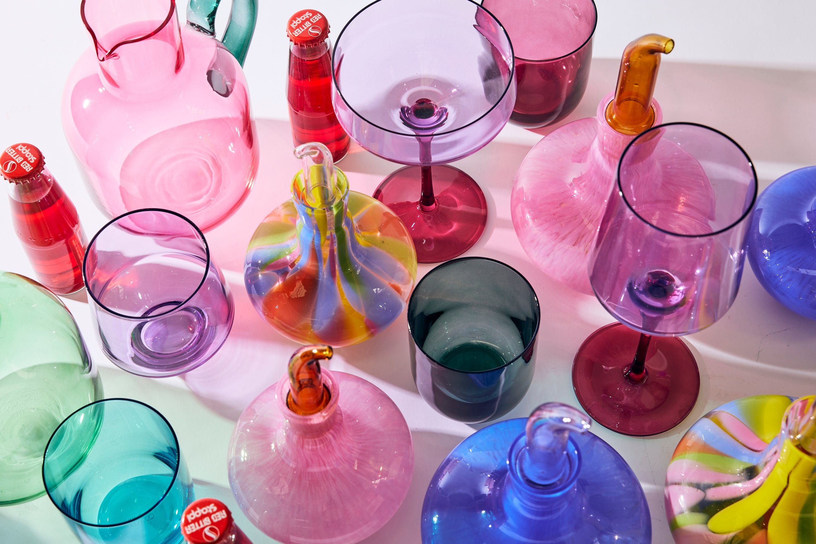 Kip & Co Isle Of Pink glass carafe and matching glass set, colorful and stylish drinkware for serving beverages.