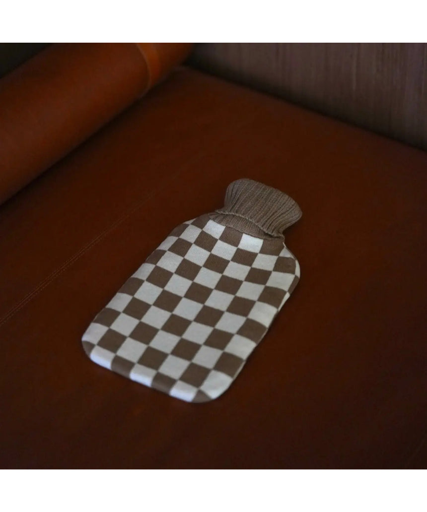 Casa Rolio hot water bottle with mocha cover, showing soft fabric and rounded shape for warmth and comfort.