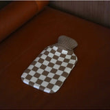 Casa Rolio hot water bottle with mocha cover, showing soft fabric and rounded shape for warmth and comfort.