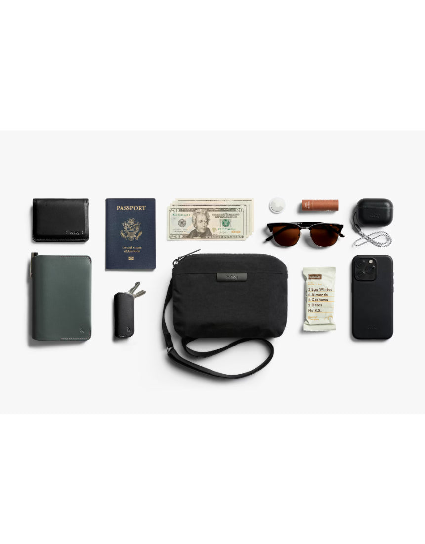 Bellroy Tokyo Side Bag in Raven, a sleek crossbody bag with multiple compartments and adjustable strap for everyday use.
