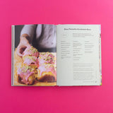 Open baking book showcasing pistachio-themed recipes from Brumby Sunstate's Pistachio Lover's Baking Book.