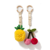 Living Textiles stroller toys featuring a colorful pineapple and cherries design, soft fabric and playful patterns.