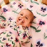 Kip & Co Pretty Pansy organic cotton baby blanket with colorful floral pattern, soft and cozy for infants.