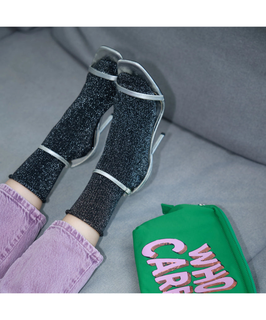 Black Glitter Lurex Socks by Klue, stylish socks with shimmering lurex fabric and a comfortable fit.