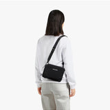 Bellroy Tokyo Side Bag in Raven, a sleek black crossbody bag with adjustable strap and minimalist design.