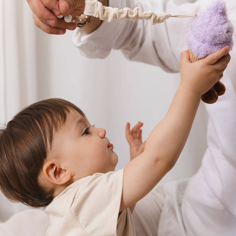 Living Textiles stroller toys featuring plush ice cream and cupcake designs for engaging baby entertainment.