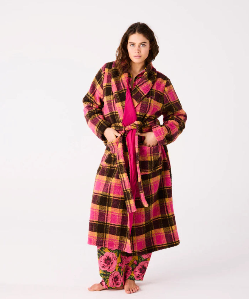 Kip & Co Alaskan adult sherpa robe in cozy, plush fabric with a relaxed fit and hood, displayed on a hanger.