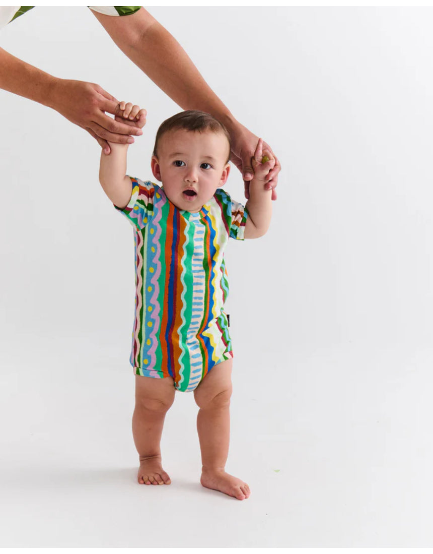 Kip & Co baby short sleeve romper featuring colorful beach pattern, lightweight cotton fabric, perfect for warm weather.