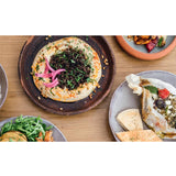 Open book showing pages with Balkan and Middle Eastern recipes from "Ibrik: The Balkan Table" by Brumby Sunstate, featuring traditional dishes.