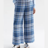 Elk Ranie Pant in blue multi-check pattern, casual pants with a relaxed fit, shown on a model.
