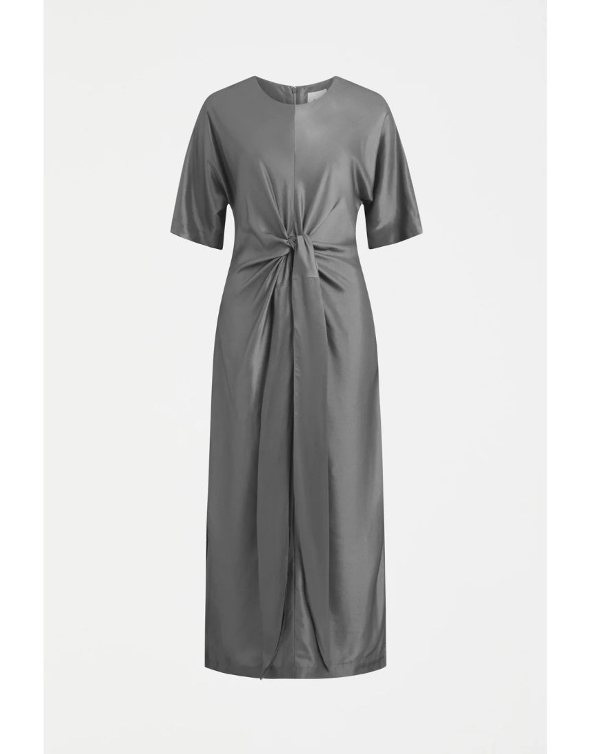 Elk Lissu Dress in silver and black, stylish clothing with a flowing design, displayed on a hanger.