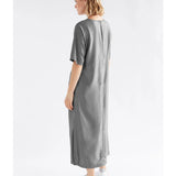 Elk Lissu Dress in silver and black, stylish clothing with a flowing design and elegant fabric, perfect for casual or dressy occasions.