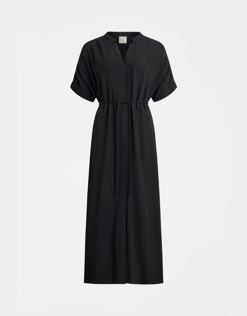 Black Elk Omia shirt dress hanging on a wooden hanger, showcasing a casual and stylish clothing piece with a button-up front.