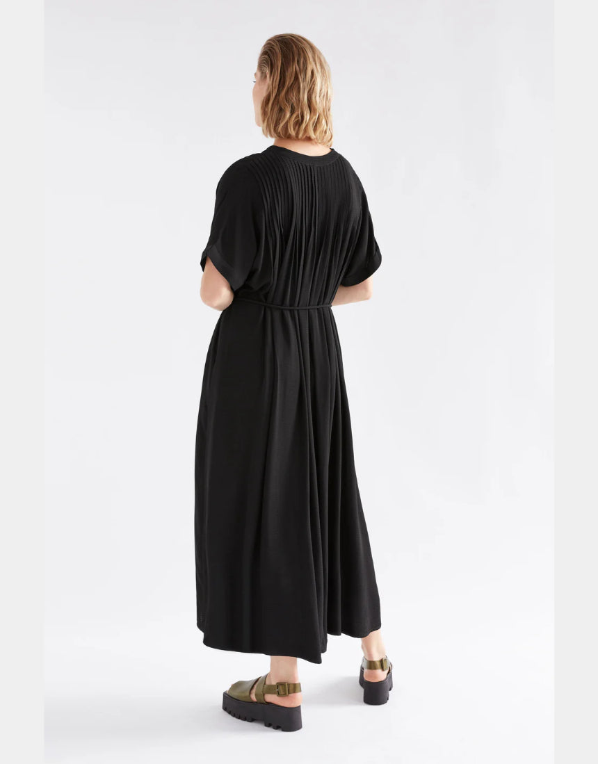 Black Elk Omia shirt dress displayed on a hanger, featuring a relaxed fit and classic collar for versatile styling.