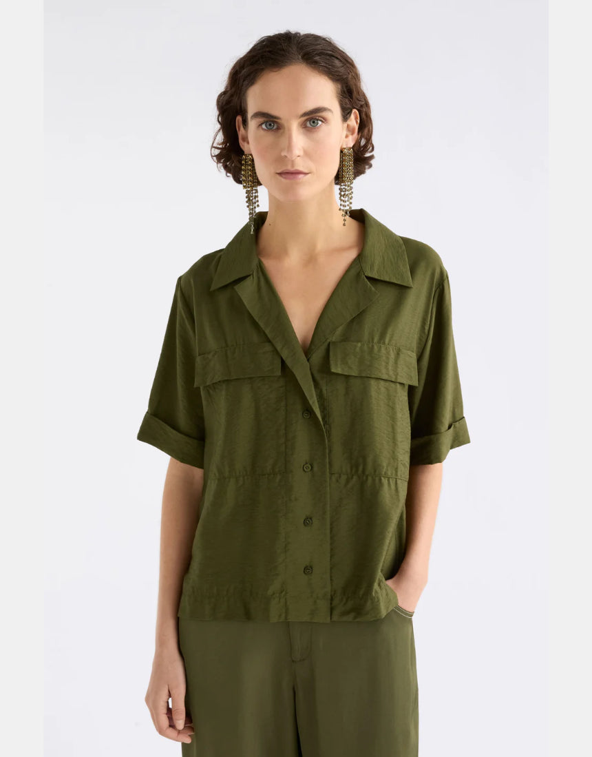 Elk Eine Shirt in Bright Olive color, casual clothing with a relaxed fit, displayed on a hanger.