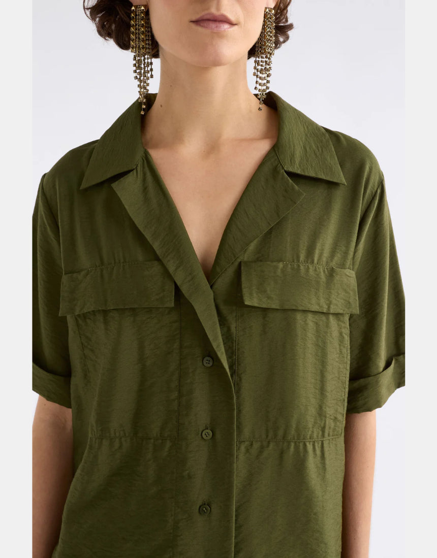 Elk Eine Bright Olive Shirt in green, casual clothing with a relaxed fit, displayed on a hanger against a neutral background.