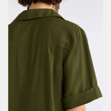 Elk Eine Bright Olive shirt in a natural fit, featuring a bright olive color and casual style, displayed on a hanger.