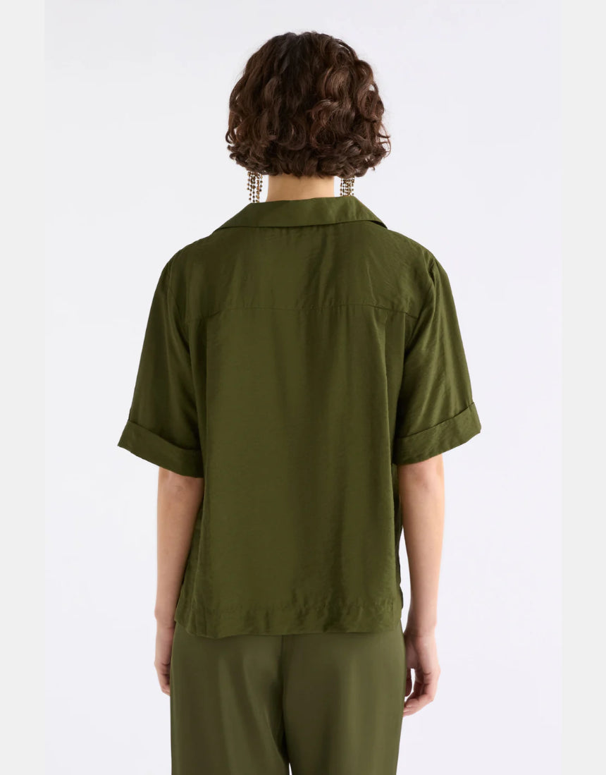 Elk Eine Shirt in Bright Olive, a casual men's clothing top with a relaxed fit and short sleeves, displayed on a hanger.