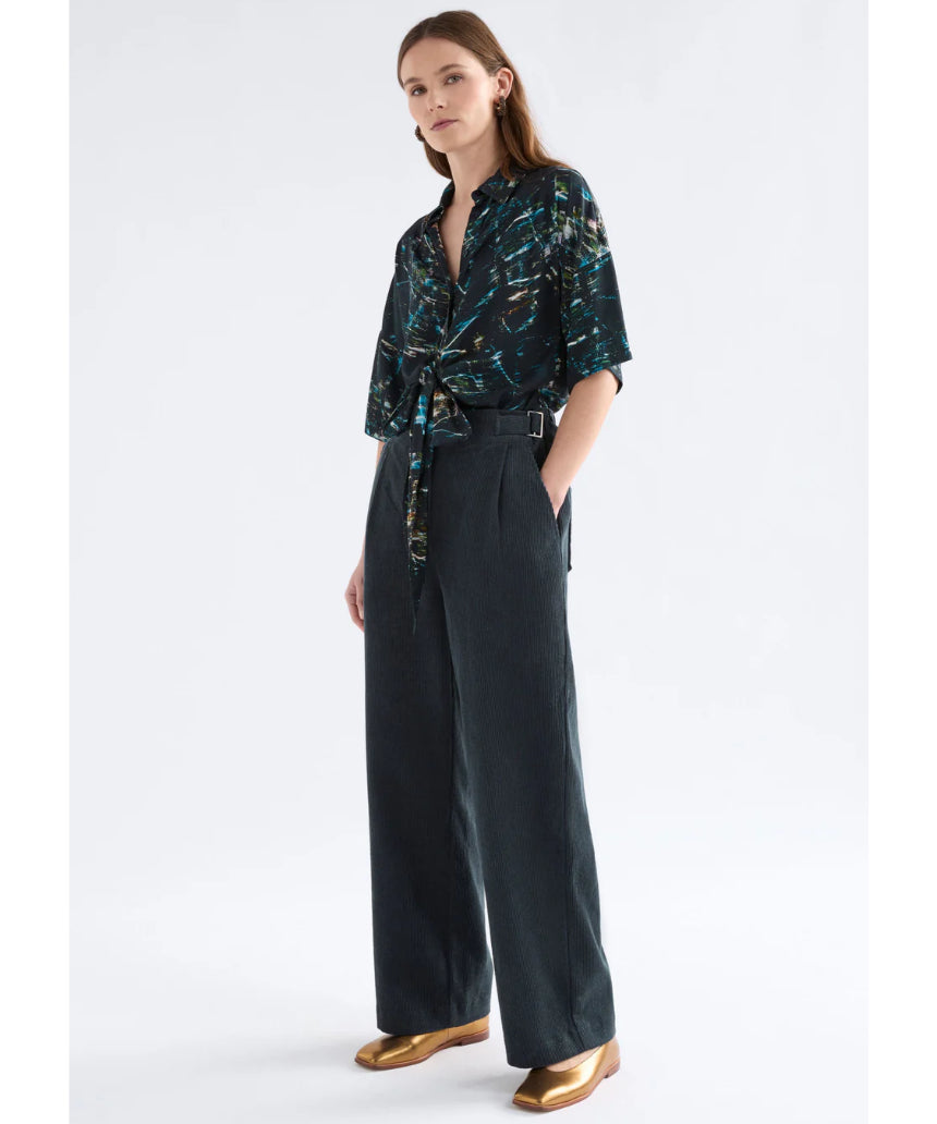Elk Noemi Cord Pant in Carbon color, showcasing stylish tapered fit and corduroy fabric, ideal for casual or outdoor wear.