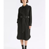 Elk Famke black dress, stylish women's clothing with a fitted silhouette, shown on a model against a neutral background.