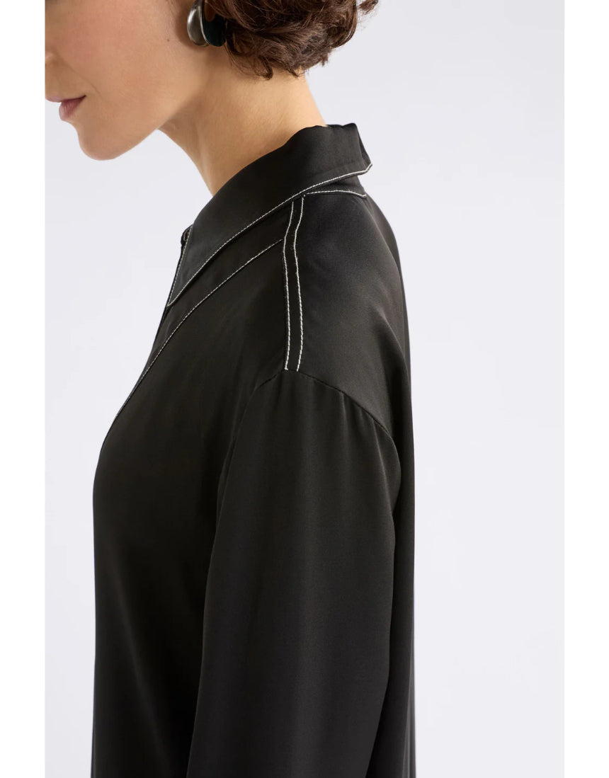 Black Elk Famke Dress, stylish women's clothing with a fitted silhouette and elegant design, shown on a model.