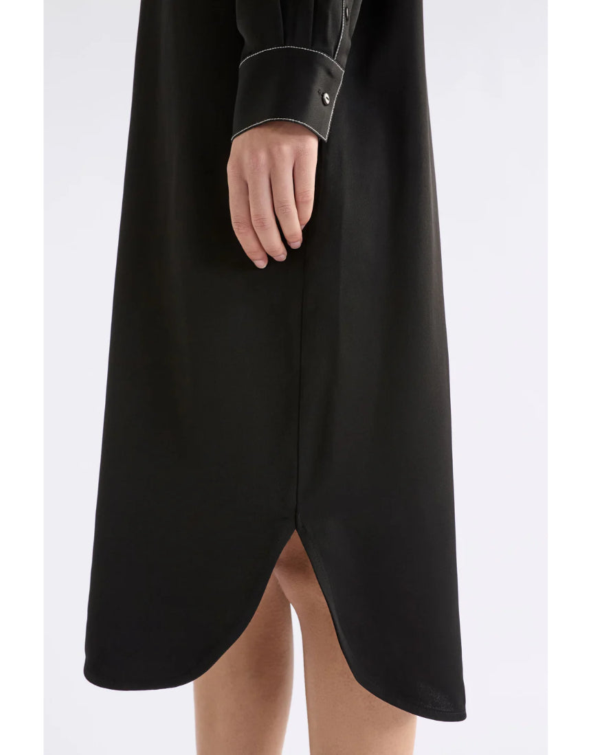 Black Elk Famke Dress, stylish women's clothing with a flattering fit, shown on a model in a natural pose.