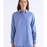 ELK The Label Dusk Blue Sol Shirt, a stylish blue top with a relaxed fit, displayed on a hanger.