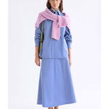 Dusk blue Elk Sol Shirt by ELK The Label, a stylish women's top with a relaxed fit and soft fabric, displayed on a hanger.