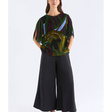 ELK The Label Reihen Top in Stribe Burnout with a relaxed fit, displayed on a hanger showcasing its soft fabric and stylish design.