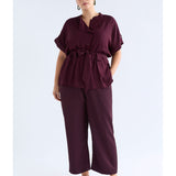 ELK The Label Hullu Pant in Shiraz color, stylish pants with a relaxed fit, made from comfortable fabric, shown on a model.