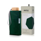Green Anatole Gustave micro-umbrella with compact design, shown open with fabric canopy and handle for easy portability.