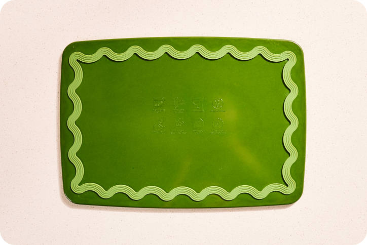 Maison Apprêt petite green chopping board with smooth wooden surface, ideal for kitchen prep and food serving.