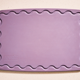 Maison Apprêt petite lilac chopping board with smooth surface and compact design for kitchen prep and serving.