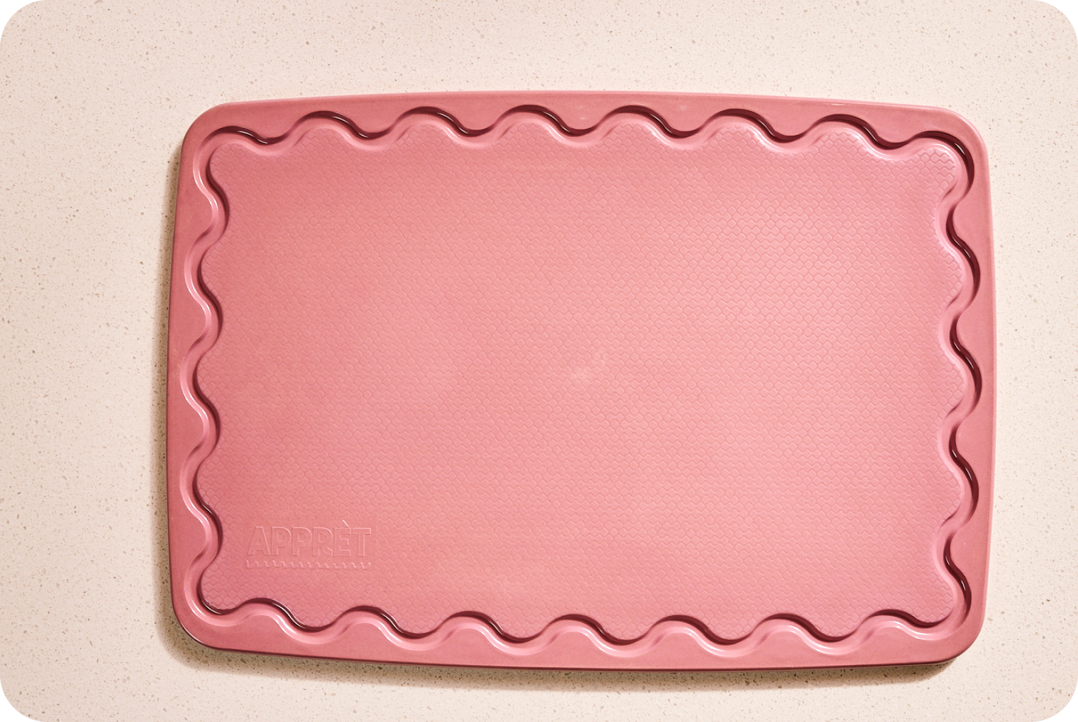 Pink Maison Apprêt Classique chopping board with smooth surface and rounded edges, ideal for food prep and serving.