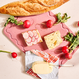 Pink Maison Apprêt Classique chopping board with smooth surface and rounded edges, ideal for kitchen prep.