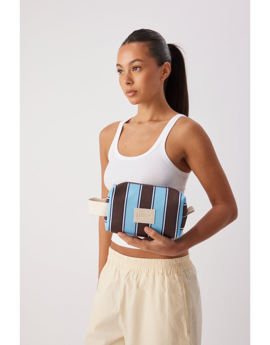 Base Ditty Base in chocolate stripe, a stylish fabric with a vibrant chocolate and white striped pattern, ideal for home decor.