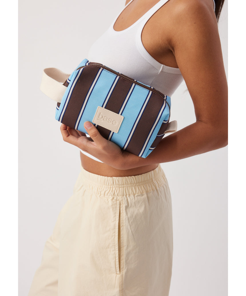 Base Ditty Base in chocolate stripe with a soft fabric and playful pattern, perfect for stylish, comfortable footwear.