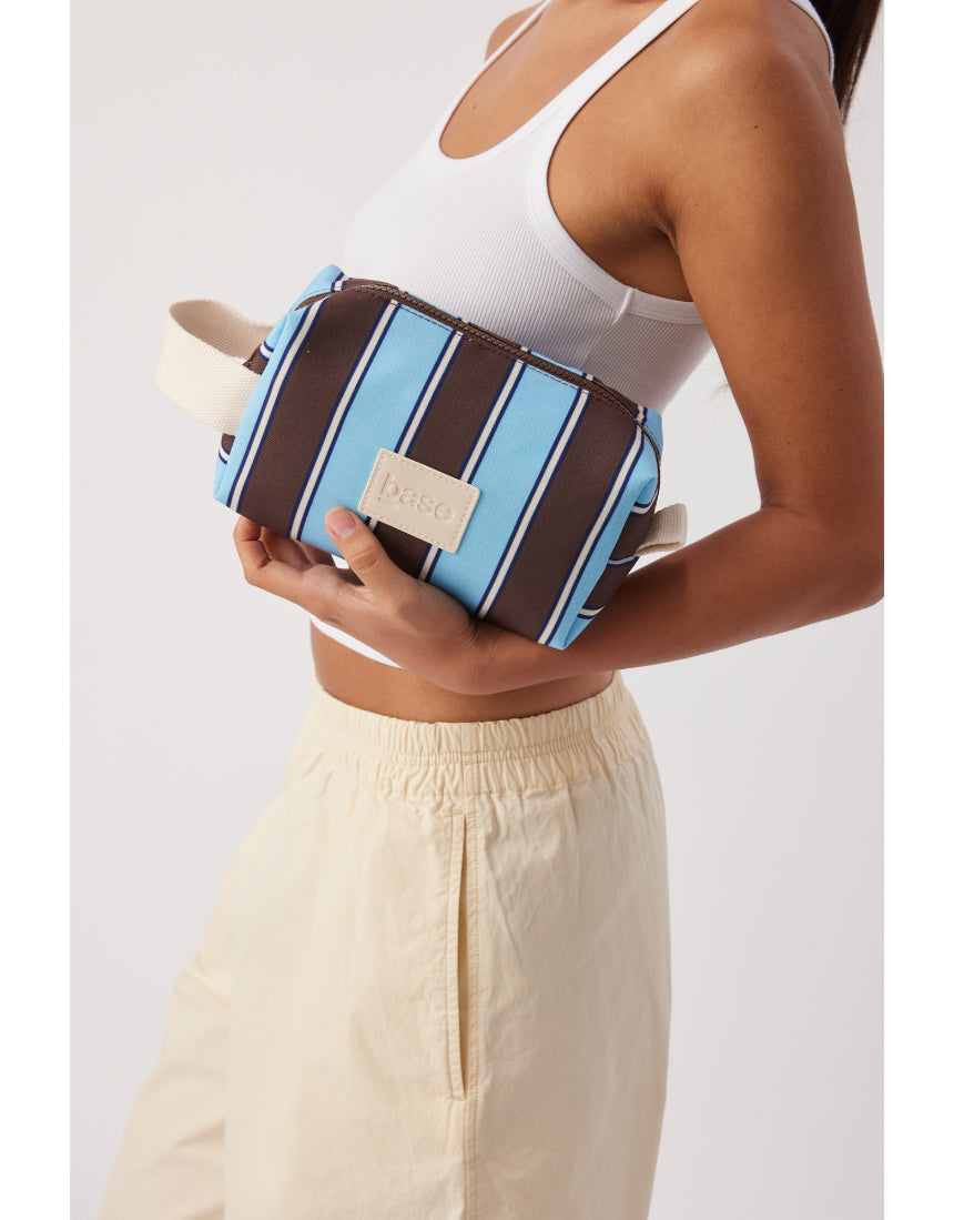Base Ditty Base in chocolate stripe with a soft fabric and playful pattern, perfect for stylish, comfortable footwear.