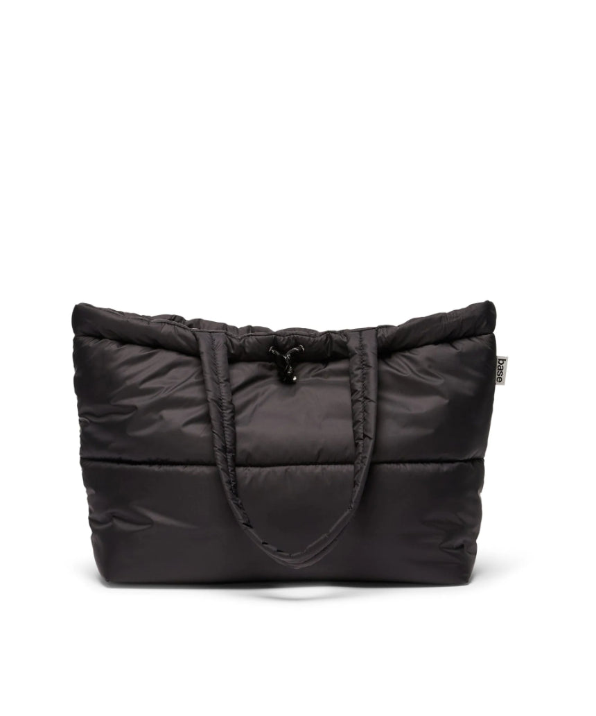 Black Scrunch Base from Base Supply, showcasing the sleek, flexible hair styling accessory with a matte finish and compact design.