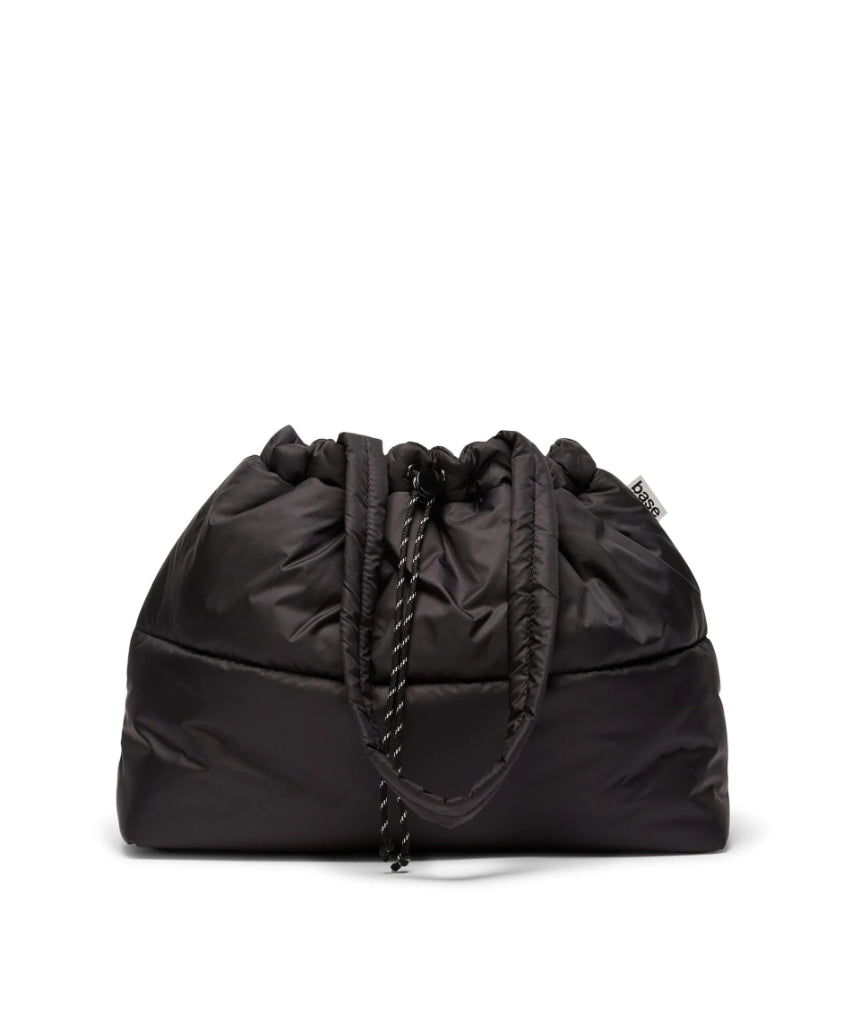 Black scrunch base from Base, featuring a sleek, round design suitable for supporting and elevating various products or displays.