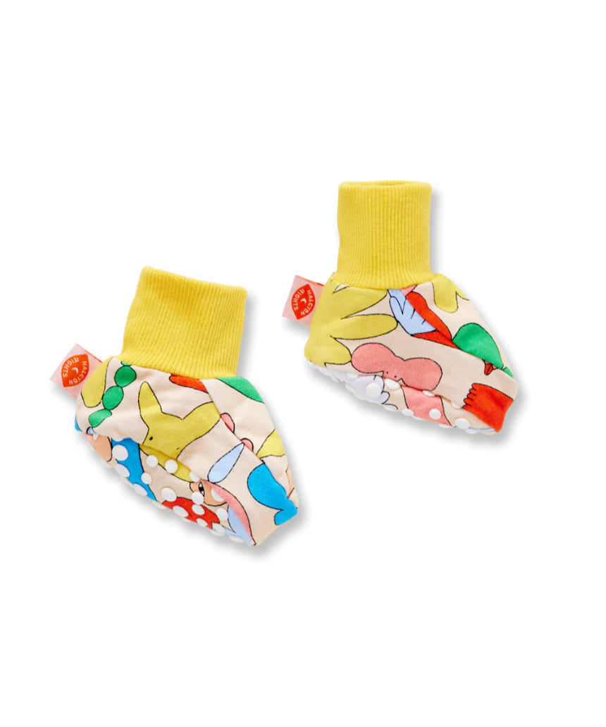 Halcyon Nights Little Billabong baby booties in soft fabric, featuring playful animal patterns and snug fit for little feet.